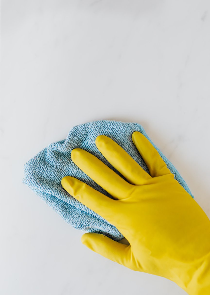 Everguard cleaning crew member wiping down a kitchen counter